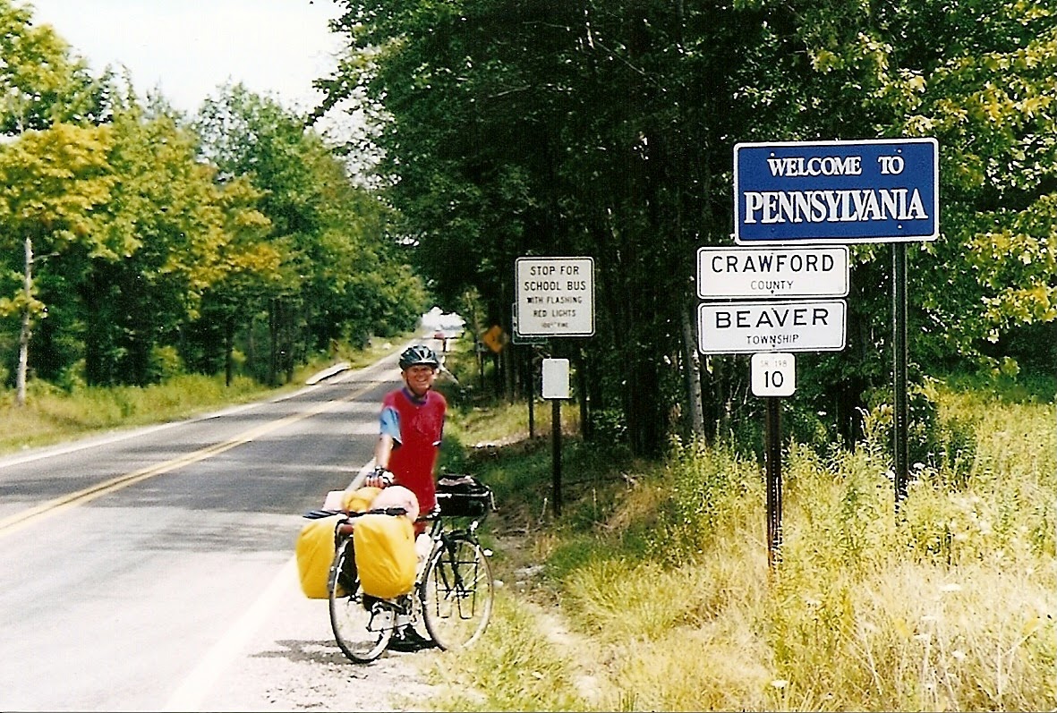 Tom or his touring bicycle photographed at the Pennsylvania state line or state landmark.